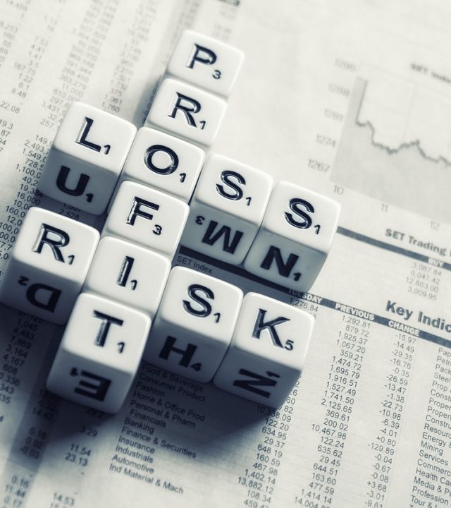 dices over newspaper, profit, loss risk-2656028.jpg